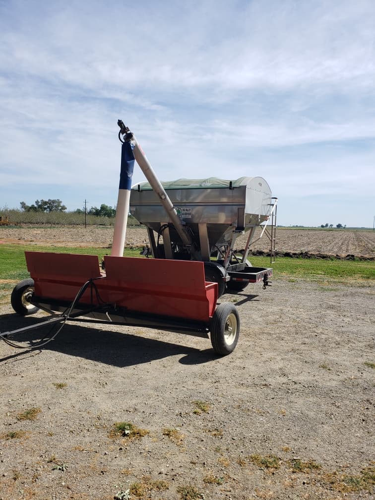 A drop spreader in a field during preplant fertilizer application